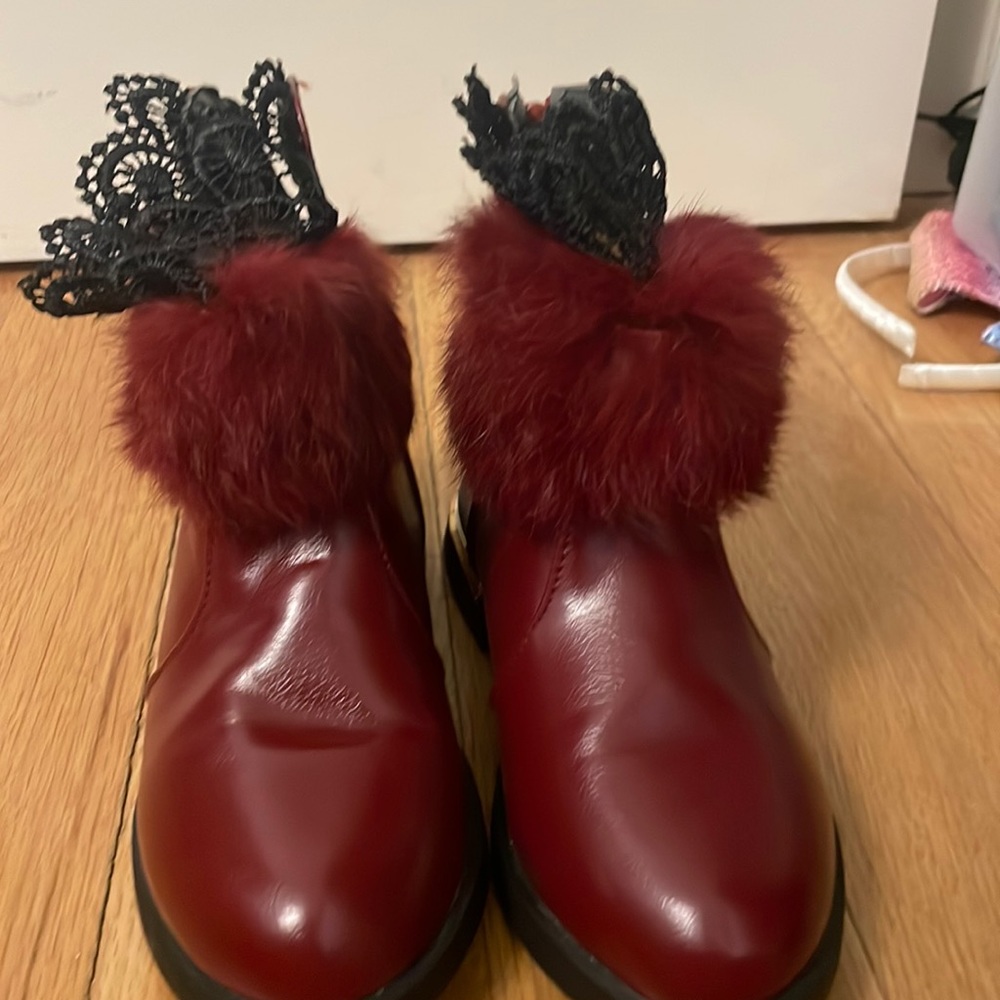 kids red booties, with red fur, black lace. never worn
